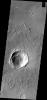 This image from NASA's 2001 Mars Odyssey spacecraft contains a relatively young crater and its ejecta. Layering in the ejecta is visible and relates to the shock waves from the impact. This unnamed crater is located in Arabia Terra.