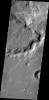 The channel in this image from NASA's 2001 Mars Odyssey spacecraft is located in northern Terra Sabaea and runs semi-parallel to Auqakuh Vallis.