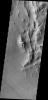 This image from NASA's 2001 Mars Odyssey spacecraft is of Lycus Sulci, located on the western side of Olympus Mons and dominated by multi-direction ridges which contains material less resistant than the ridges to the effects of wind.