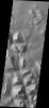 This image from NASA's 2001 Mars Odyssey spacecraft shows a portion of Hydraotes Chaos. The individual hills on the left side of the image also appear to be layered.