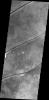 The fractures in this image captured by NASA's 2001 Mars Odyssey spacecraft are aligned with most of the fractures in Tempe Terra on Mars, but are some distance from the bulk of the fracturing.