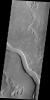 The channel in this image captured by NASA's Mars Odyssey spacecraft is called Hrad Vallis. Hrad Vallis is located on the northwestern margin of the Elysium volcanic complex.