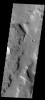 A small fan-shaped delta is located where a channel meets the floor of this unnamed crater in Terra Cimmeria, as shown in this image from NASA's 2001 Mars Odyssey spacecraft.