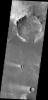 This image from NASA's 2001 Mars Odyssey spacecraft shows a portion of northeastern Syrtis Major. In this image are several windstreaks and a lava flow that has entered the crater on the top of the image.