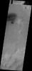 This image from NASA's Mars Odyssey spacecraft shows a small field of dunes and associated dust devil tracks located on the floor of this unnamed crater on the rim of Roddenberry Crater.