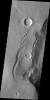 This image captured by NASA's 2001 Mars Odyssey spacecraft shows Martian terrain that resembles the head of an eagle with a sharp beak.