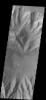 This image captured by NASA's 2001 Mars Odyssey spacecraft shows part of the floor of Coprates Chasma, including a large sand sheet and smaller dunes.
