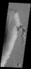 This image captured by NASA's 2001 Mars Odyssey spacecraft shows several features in Shalbatana Vallis. A tributary channel appears to have created a delta deposit in the upper half of the image, and several landslide deposits in the lower half.