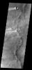 This image shows several wind streaks in Syrtis Major Planum as seen by NASA's 2001 Mars Odyssey spacecraft.