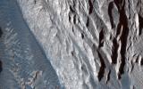 This observation from NASA's Mars Reconnaissance Orbiter shows one of the first close HiRISE views of the enigmatic Valles Marineris interior layered deposits.