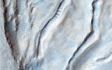 This image from NASA's Mars Reconnaissance Orbiter shows an unusual landform on the floor of Oxus Patera. Oxus Patera is an ancient, eroded depression in northern Arabia Terra.