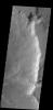 A delta deposit is located where a channel enters Ismenius Cavus in this image captured by NASA's 2001 Mars Odyssey spacecraft.