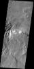 This image from NASA's 2001 Mars Odyssey spacecraft shows several channels dissecting the rim of Semeykin Crater.