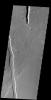 The linear depressions in this image from NASA's 2001 Mars Odyssey spacecraft are called graben. Graben are bounded on both sides by faults, and the central material has shifted downward between the faults.