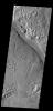 The channel in this image captured by NASA's 2001 Mars Odyssey spacecraft is a portion of Hrad Vallis.