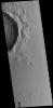 This image from NASA's 2001 Mars Odyssey spacecraft shows dark slope streaks on the inner rim of an unnamed crater in Amazonis Planitia.