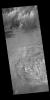 The unusual texture seen in this image of Galle Crater is likely layered deposits that have been eroded. Small dune and windstreak features in this image from NASA's 2001 Mars Odyssey spacecraft, indicate that winds are part of the erosive process.
