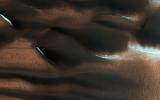 This image from NASA's Mars Reconnaissance Orbiter spacecraft shows modified barchan dunes with shapes that resemble 'raptor claws.' The unusual morphology of these dunes suggests a limited supply of windblown sand.
