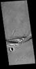 This image from NASA's 2001 Mars Odyssey spacecraft shows a portion of Olympica Fossae. In this image several lava channels are visible, and it appears that lava has flowed in the larger depressions.