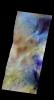 The THEMIS camera contains 5 filters. The data from different filters can be combined in multiple ways to create a false color image. This image captured by NASA's 2001 Mars Odyssey spacecraft shows two large sand dunes.
