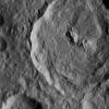 Tupo Crater on Ceres is seen in this view from NASA's Dawn spacecraft. This crater, located in the southern hemisphere of Ceres, was named for a Polynesian god of turmeric. Dawn captured the scene on Dec. 24, 2015.