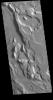This image from NASA's 2001 Mars Odyssey spacecraft shows a small portion of Ares Vallis. With the different elevations within the broad channel, it is thought that multiple periods of flow successively eroded lower and lower into the surface.