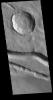 The linear features in this image captured by NASA's 2001 Mars Odyssey spacecraft are located west of Elysium Mons.