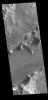 The channel feature in this image from NASA's 2001 Mars Odyssey spacecraft is called Mangala Fossa. This feature was formed by tectonic activity, with the walls being faults that allowed the central portion to slide downward forming a graben.