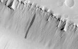 The two linear depressions in this image from NASA's Mars Reconnaissance Orbiter spacecraft form part of the Elysium Fossae complex, a group of troughs located in the Elysium quadrangle of Mars.