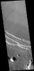 This image captured by NASA's 2001 Mars Odyssey spacecraft shows part of the summit caldera of Arsia Mons.