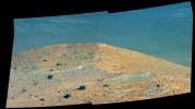 This enhanced scene from the panoramic camera (Pancam) on NASA's Mars Exploration Rover Opportunity shows 'Spirit Mound' overlooking the floor of Endeavour Crater.