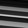 In this image from NASA's Cassini spacecraft, a bright and narrow ringlet located toward the outer edge of the C ring is flanked by two broader features called plateaus.