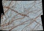 This image from NASA's Galileo Solid-State Imager (SSI) shows Europa's surface is covered with a vast network of linear features such as cracks, ridges, and bands.