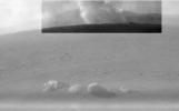 This image from one of the rear Hazcams, aboard NASA's Perseverance Mars rover, shows a smoke plume from the crashed descent stage that lowered the rover to the Martian surface.