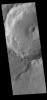 This image from NASA's Mars Odyssey shows a part of an unnamed crater in Terra Cimmeria. The finger-like projection from the southern rim towards the central peak is a landslide deposit.