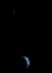 This picture of a crescent-shaped Earth and Moon, the first of its kind ever taken by a spacecraft, was recorded Sept. 18, 1977, by NASA's Voyager 1 when it was 7.25 million miles (11.66 million kilometers) from Earth.