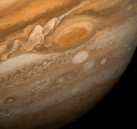 This dramatic view of Jupiter's Great Red Spot and its surroundings was obtained by NASA's Voyager 1 on Feb. 25, 1979. The colorful, wavy cloud pattern to the left of the Red Spot is a region of extraordinarily complex end variable wave motion. 
