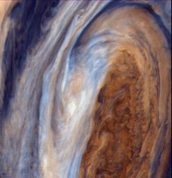This view of the Great Red Spot is seen in greatly exaggerated color. The colors do not represent the true hues seen in the Jovian atmosphere but have been produced by special computer processing to enhance subtle variations in both color and shading.