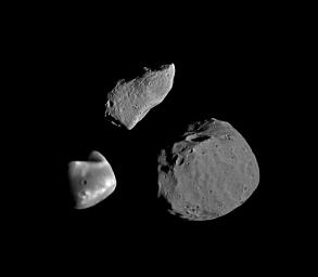 This montage from NASA's Galileo orbiter taken on shows asteroid 951 Gaspra (top) compared with Deimos (lower left) and Phobos (lower right), the moons of Mars.
