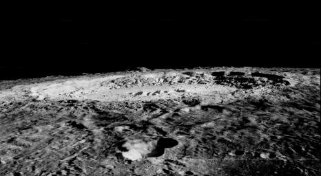 Copernicus is 93 km wide and is located within the Mare Imbrium Basin, northern nearside of the Moon (10 degrees N., 20 degrees W.). This image from NASA's Lunar Orbiter shows crater floor, floor mounds, rim, and rayed ejecta.