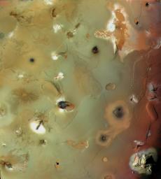 Io's volcanic plains are shown in this image from NASA's Voyager 1 taken in 1998. Also visible are numerous volcanic calderas and two large mountains (Euboea Montes, just above 
center, and Haemus Montes, at lower left).