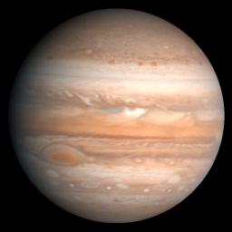 This processed color image of Jupiter was produced in 1990 by the U.S. Geological Survey from a Voyager image captured in 1979. Zones of light-colored, ascending clouds alternate with bands of dark, descending clouds.
