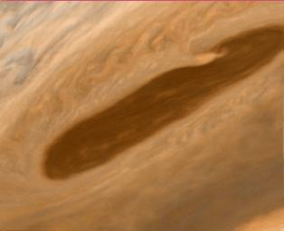 This image returned NASA's Voyager 2 shows one of the long dark clouds observed in the North Equatorial Belt of Jupiter. A high, white cloud is seen moving over the darker cloud, providing an indication of the structure of the cloud layers.