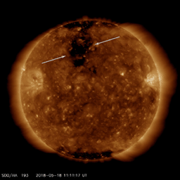 On May 16-18, 2018, NASA's Solar Dynamics Observatory observed a good-sized coronal hole come around to where it is just about faced Earth. Coronal holes are areas of open magnetic field from which solar wind (charged particles) streams into space.