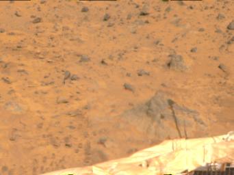 A shadow of the Atmospheric Structure Instrument/Meteorology Package (ASI/MET) has been cast on a rock at right in this image, taken by NASA's Imager for Mars Pathfinder (IMP) on July 8, 1997.