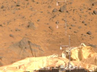The Atmospheric Structure Instrument/Meteorology Package (ASI/MET) is the mast and windsocks at the center of this color image, taken by NASA's Imager for Mars Pathfinder (IMP) on July 8, 1997.