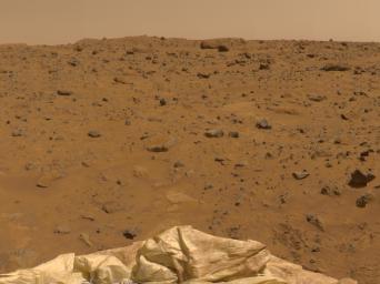This view to the Northeast was imaged by NASA's Imager for Mars Pathfinder (IMP) as part of a 360-degree color panorama, taken over sols Jul. 12-14, 1997. A deflated airbag is at the bottom of the image.