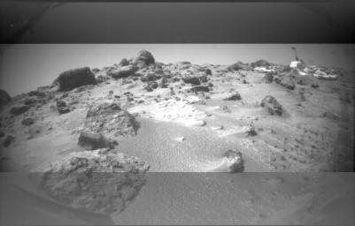This image was taken by NASA's Sojourner rover's left front camera on Sol 32. The Pathfinder lander is at right and is about 9 meters away. Sol 1 began on July 4, 1997.