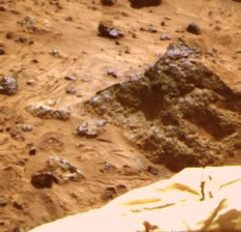 The 'Mini Matterhorn' is a 3/4 meter rock immediately east-southeast of NASA's Mars Pathfinder lander. This image shows a 'raw,' standard-resolution color frame of the rock. Sol 1 began on July 4, 1997.
