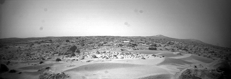 This is the right image of a stereo pair taken by NASA's Sojourner rover in the area behind the 'Rock Garden' at the Pathfinder landing site and gives a view of the Martian surface not seen from the lander. Sol 1 began on July 4, 1997.